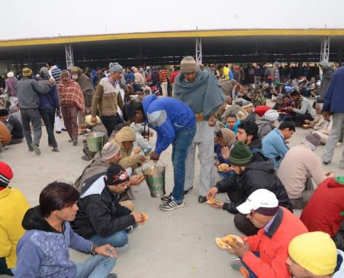 Sadh-Sangat taking the 

Holy Langar after The Naam-Charcha